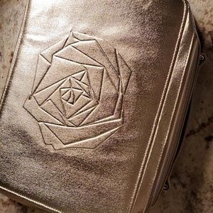 Gold Lancome makeup bag